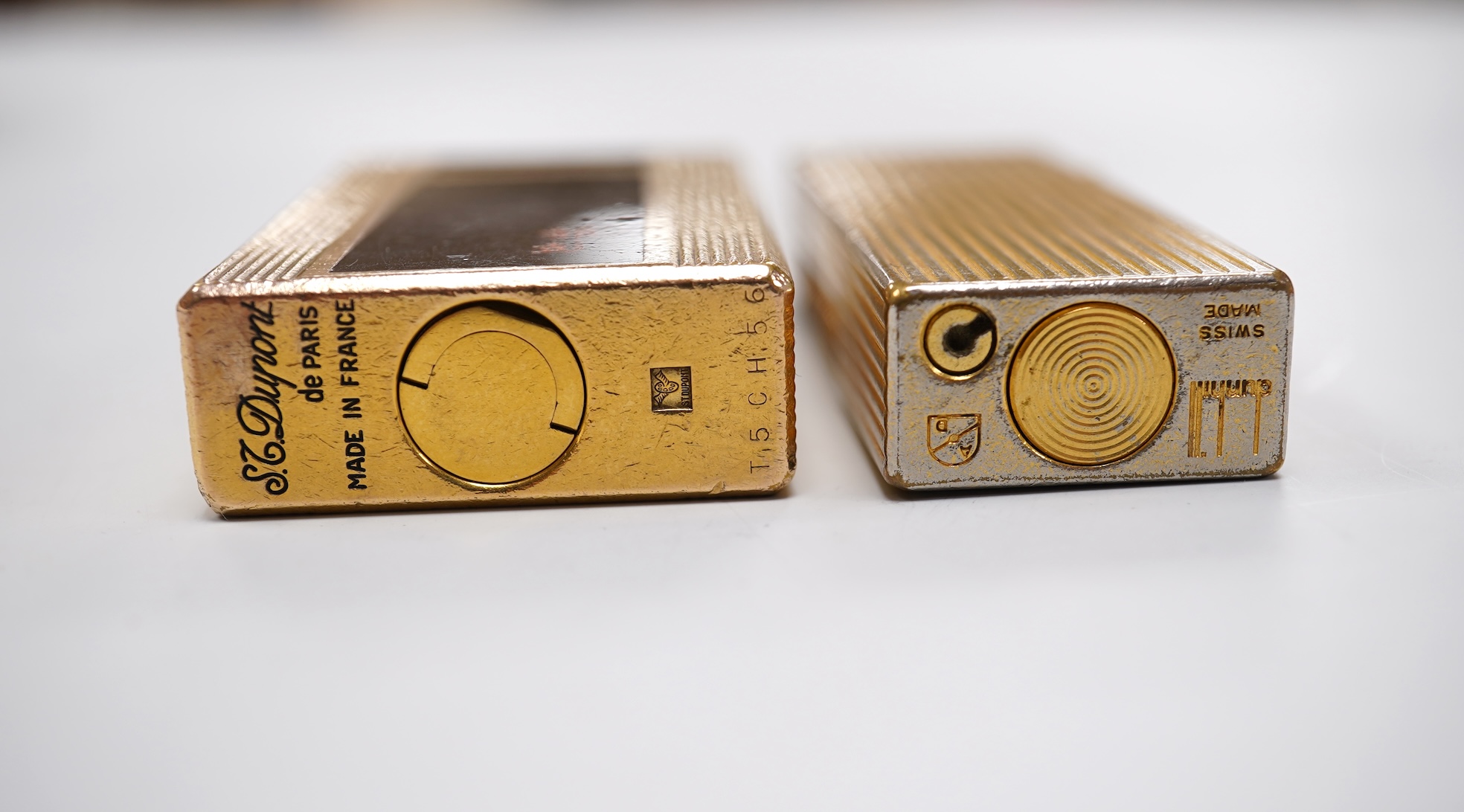 Sundry items comprising two Dupont and Dunhill lighters and cased gold and a set of cased pearl dress studs